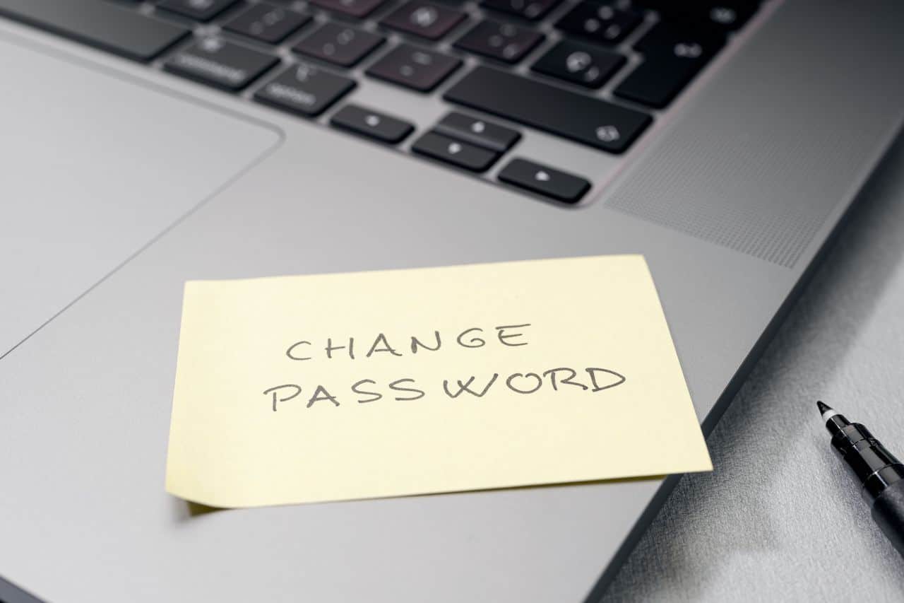 sticky note on laptop set as reminder to implement proper password protection