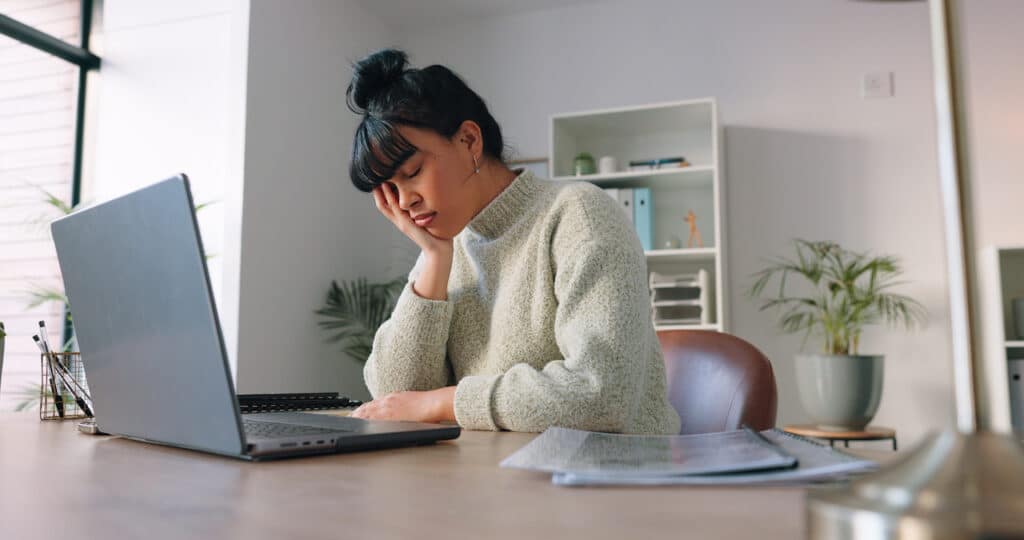 business woman working from home experiencing data incident, recovering with disaster recovery services